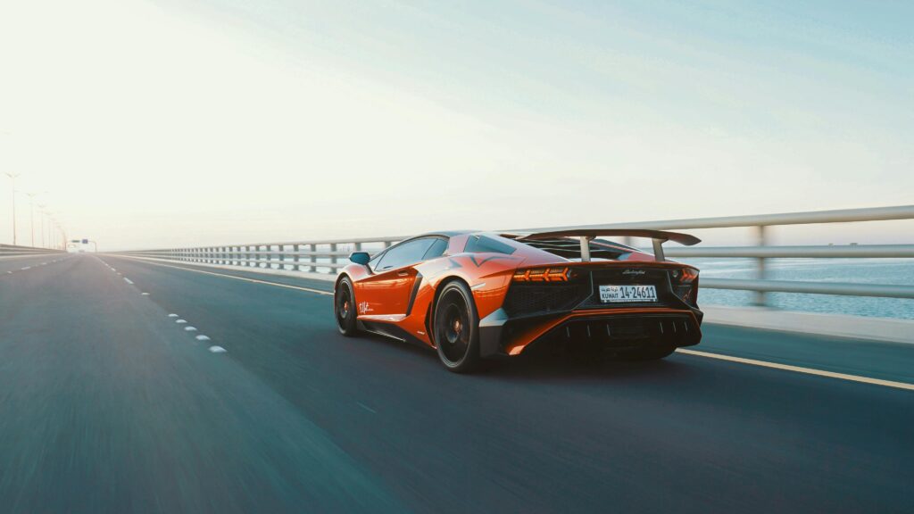 a lamborghini car going through on a bridge