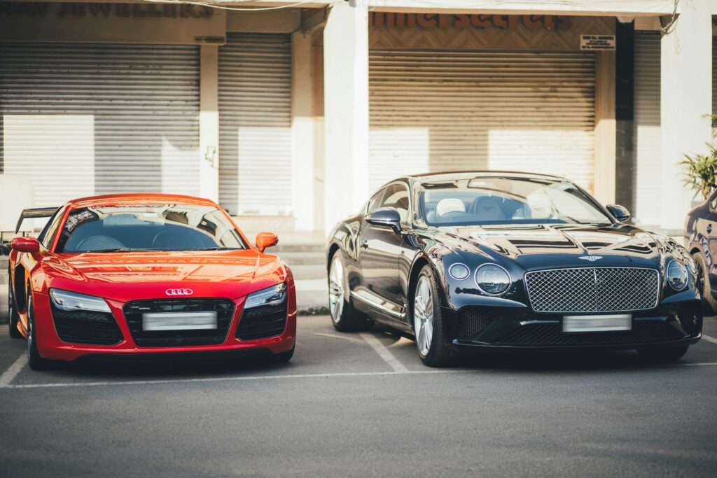 two cars parked in road side